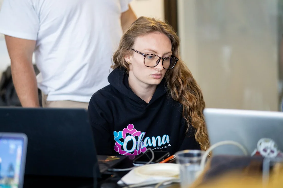 A BIES member reading the Builder Spotlight newsletter